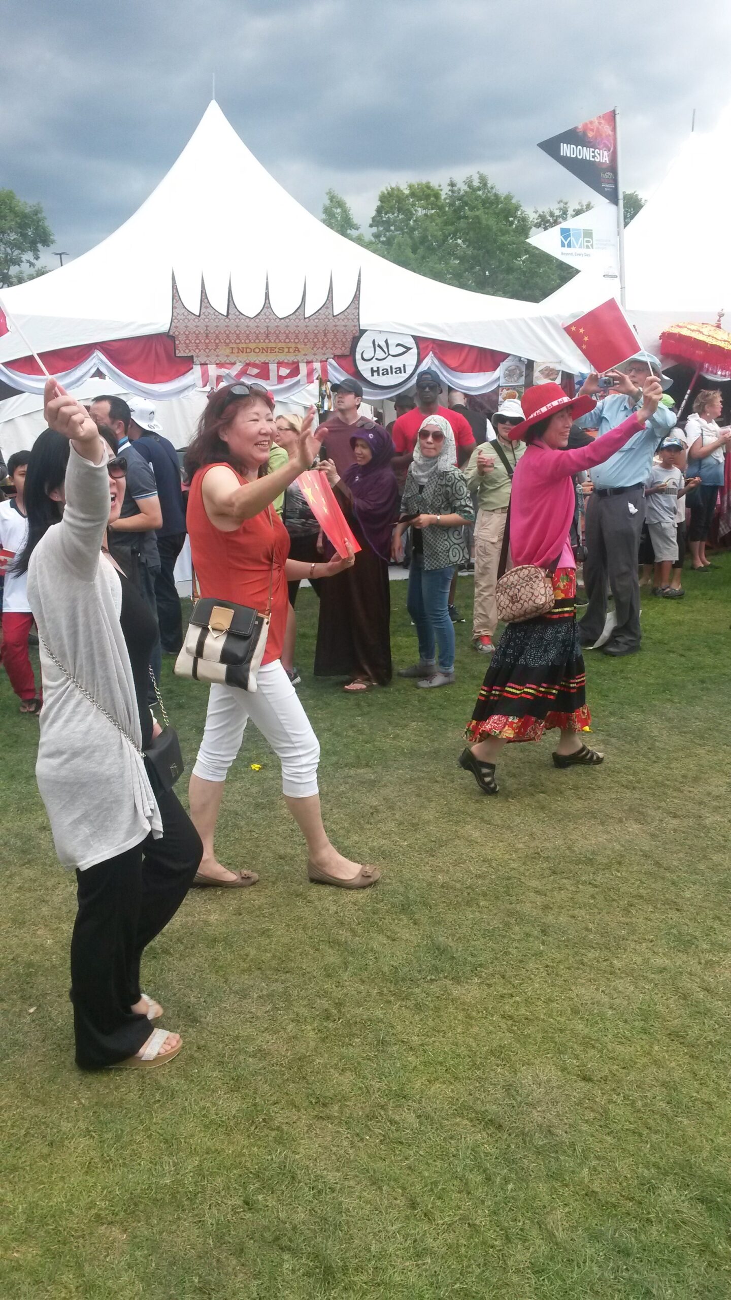 Community members dancing at a multicultural festival