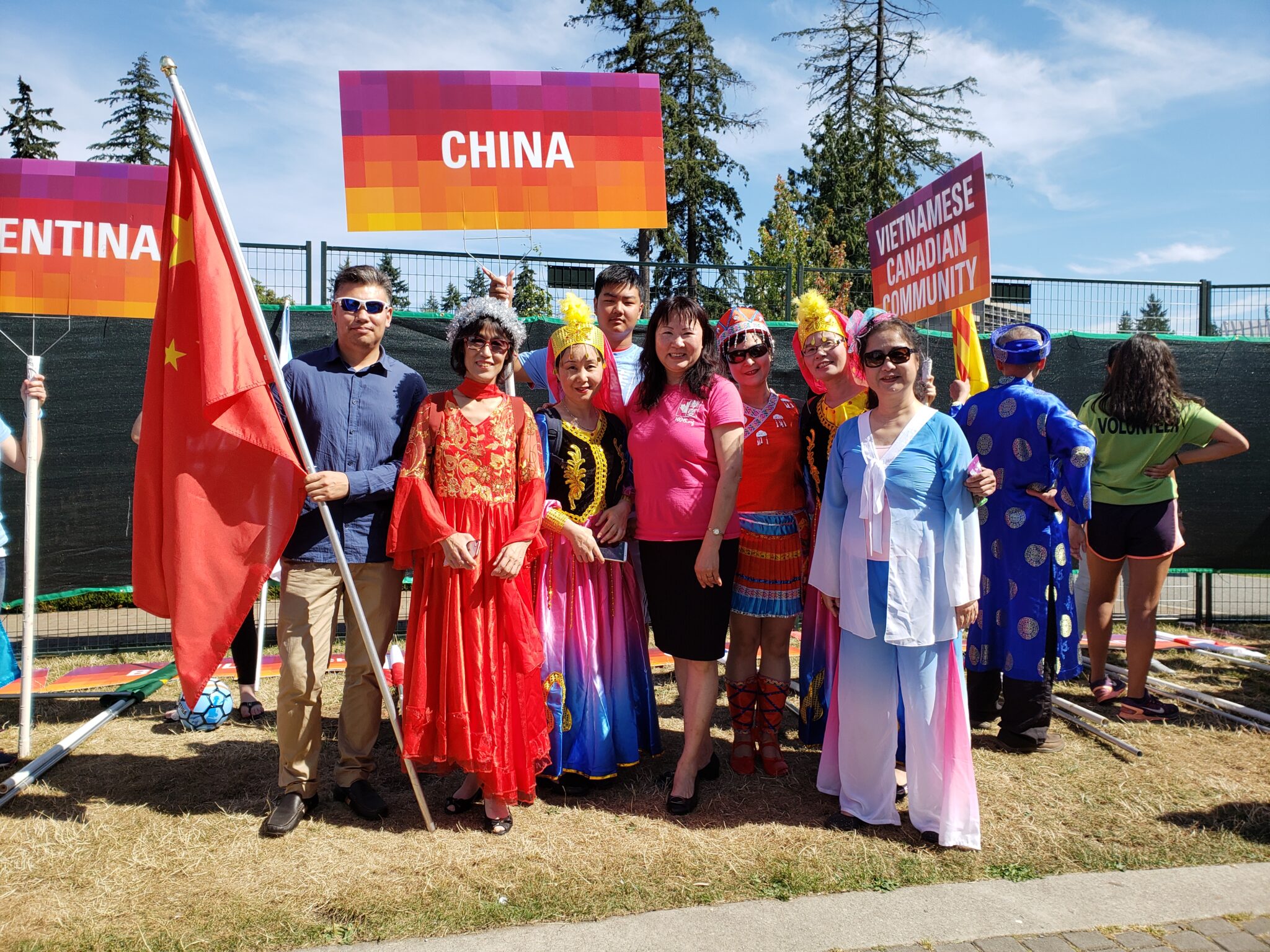 Community members in colourful cultural clothing at a festival